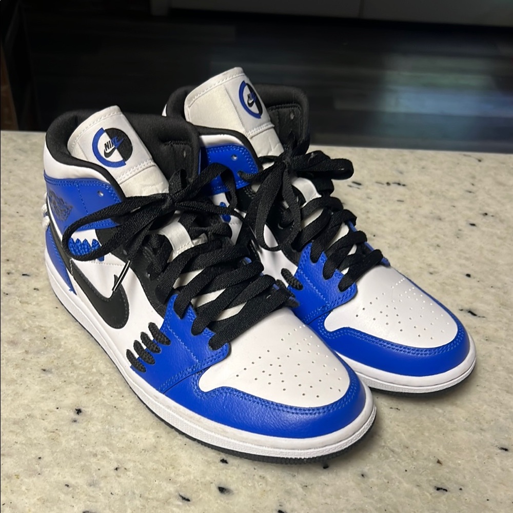 Nike Air Jordan’s Black, Blue, and White High-Top Sneakers